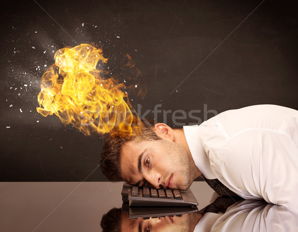 Stressed business man's head is burning Stock photo © ra2studio