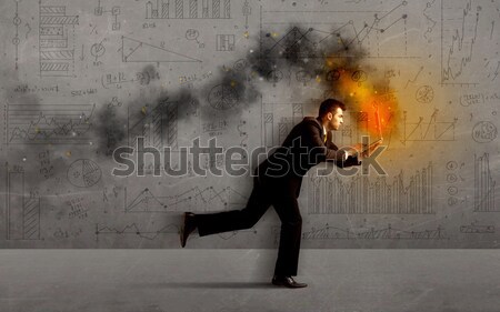 Fut üzletember tűz laptop sietség üzlet Stock fotó © ra2studio