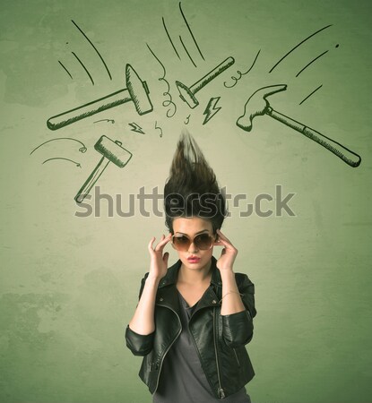 Stock photo: Tired woman with hair style and headache hammer symbols 