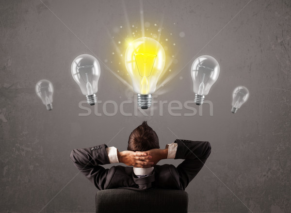 Stock photo: Business person having an idea light bulb concept