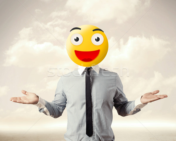 businessman wears yellow smiley face Stock photo © ra2studio