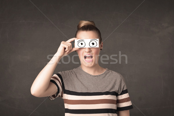 Funny woman looking with hand drawn paper eyes Stock photo © ra2studio