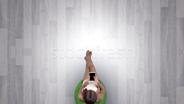 Woman sitting in chair in an empty office Stock photo © ra2studio