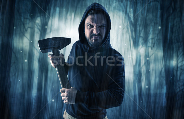 Armed hitman in dark nocturnal forest concept Stock photo © ra2studio