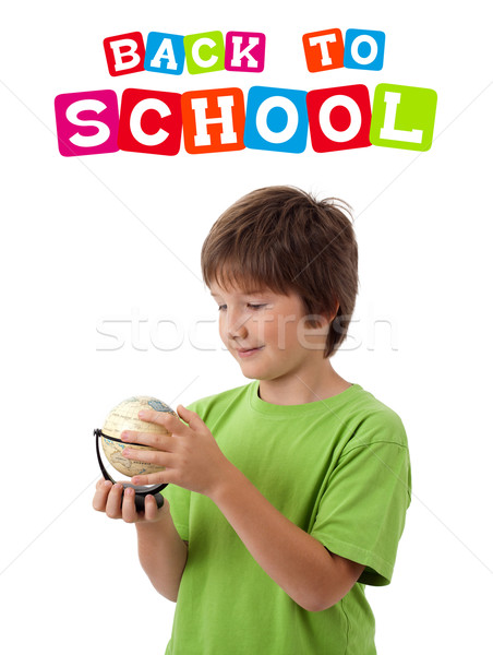 Stock photo: Boy looking with back to school theme isolated on white