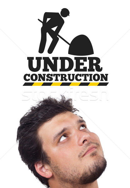 Young head looking at contruction icons Stock photo © ra2studio