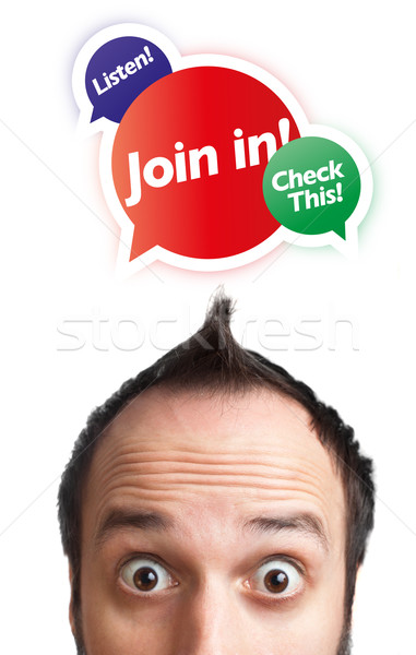 Young man with Join in mark over his head Stock photo © ra2studio