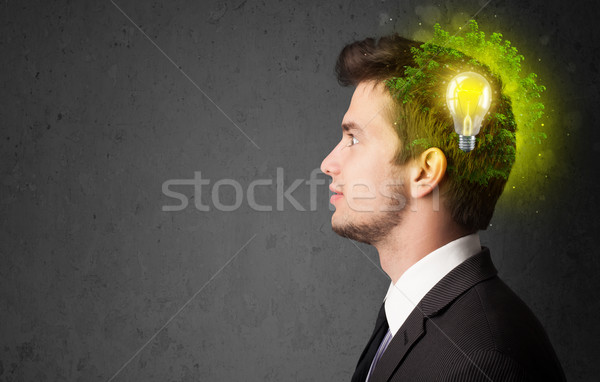Young mind thinking of green eco energy with lightbulb Stock photo © ra2studio