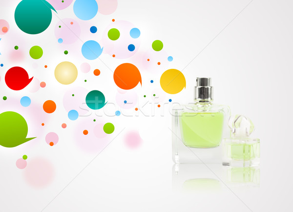 Perfume bottle spraying colored bubbles Stock photo © ra2studio