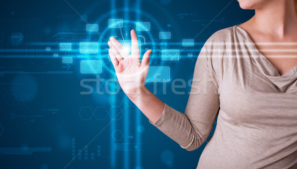 Stock photo: Woman pressing high tech type of modern buttons 