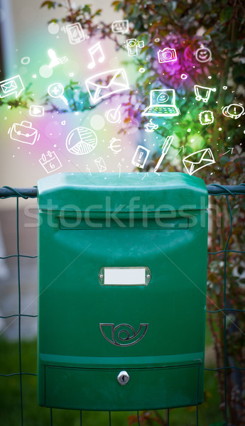 Colorful icons and symbols bursting out of a mailbox Stock photo © ra2studio