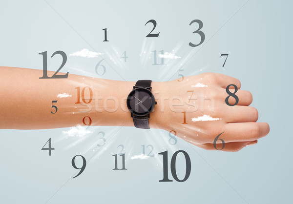 Hand with watch and numbers on the side comming out Stock photo © ra2studio