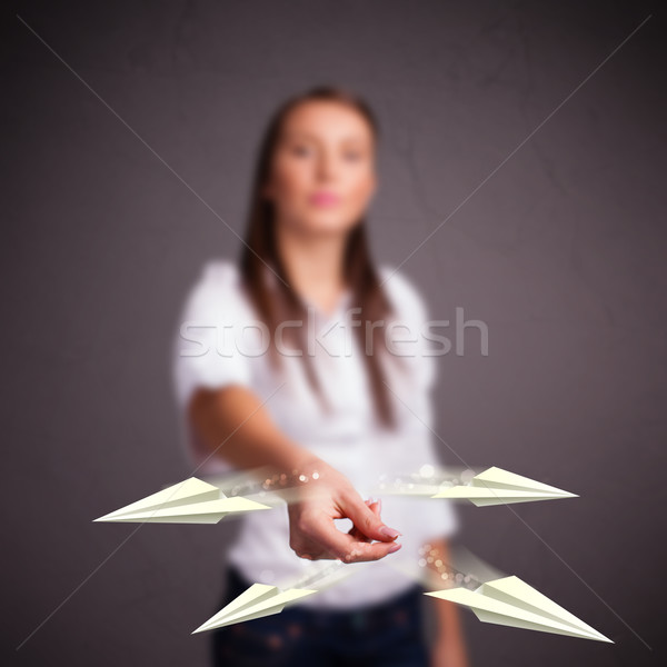 Beautiful lady throwing origami airplanes Stock photo © ra2studio