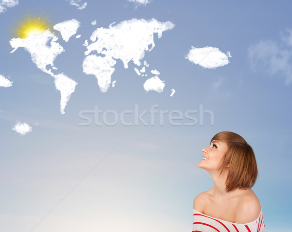 Young girl looking at world clouds and sun on blue sky Stock photo © ra2studio