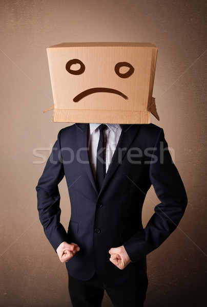 Businessman gesturing with cardboard box on his head with sad fa Stock photo © ra2studio