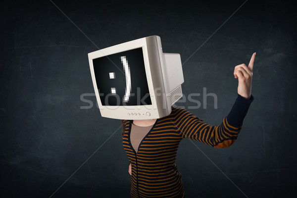 Funny girl with a monitor box on her head and a smiley face  Stock photo © ra2studio