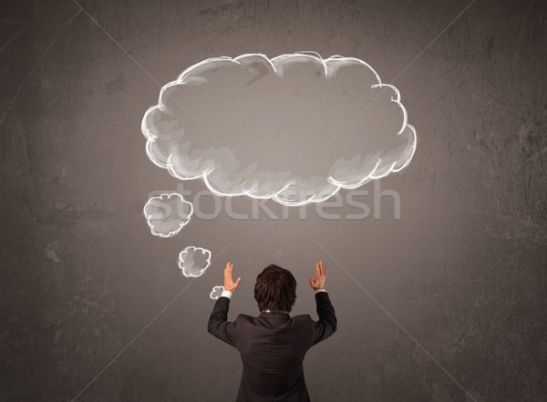 Businessman with cloud thought above his head Stock photo © ra2studio