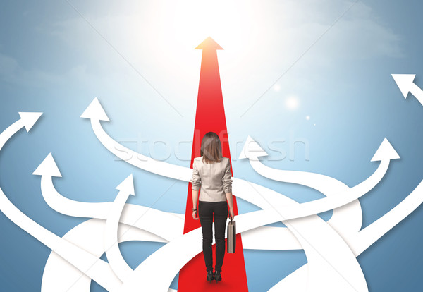 businesswoman with different direction arrows Stock photo © ra2studio