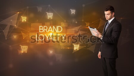 Businessman holding a white steamy cup Stock photo © ra2studio