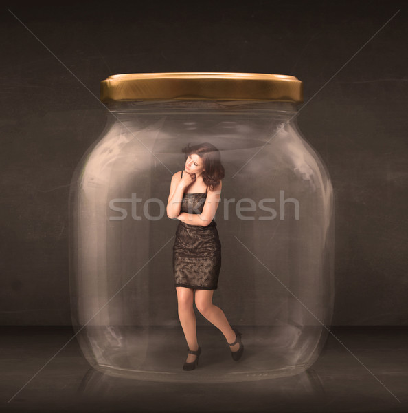 Businesswoman captured in a glass jar concept Stock photo © ra2studio