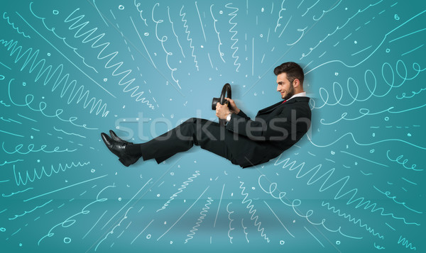 Funny guy drives an imaginary vehicle with drawn lines around hi Stock photo © ra2studio