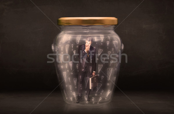 Business man trapped in jar with exclamation marks concept Stock photo © ra2studio