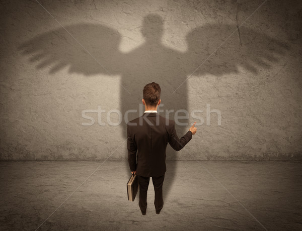 Stock photo: Honest salesman with angel shadow concept