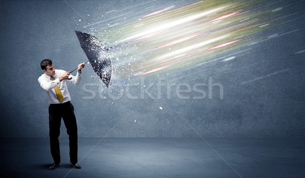 Uomo d'affari luce ombrello business acqua lavoro Foto d'archivio © ra2studio