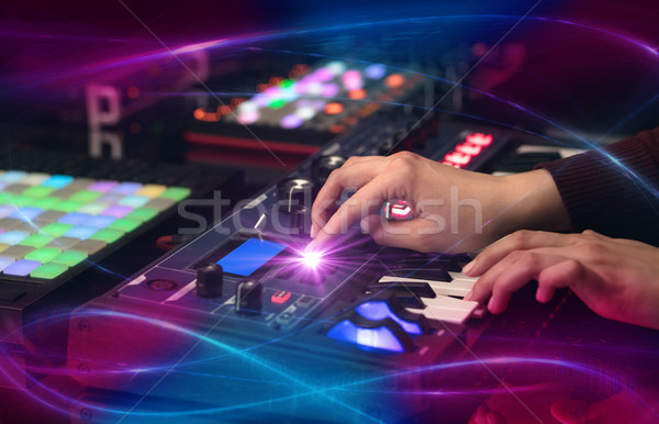Hand mixing music on midi controller with wave vibe concept Stock photo © ra2studio