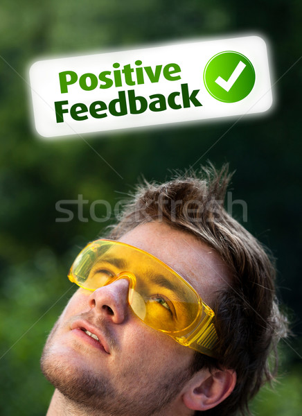 Jeunes tête regarder positif négatifs signes Photo stock © ra2studio