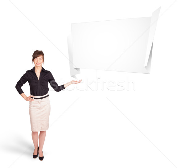 young woman presenting abstract origami copy space Stock photo © ra2studio