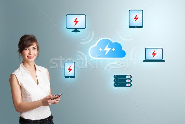 Stock photo: Beautiful young woman making phone call and presenting cloud computing network