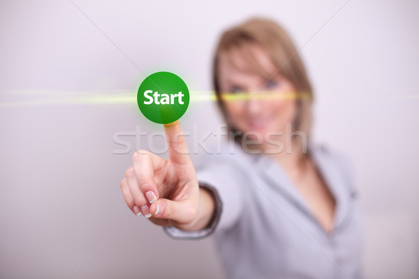 Vrouw start knop een hand Stockfoto © ra2studio