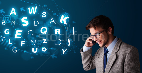 Young boy making phone call with shiny characters Stock photo © ra2studio