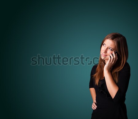 Young woman making phone call with copy space Stock photo © ra2studio