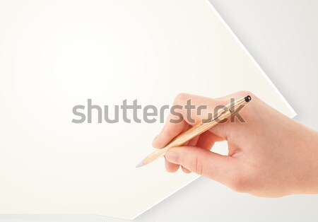 Hand writing on plain empty white paper copy space Stock photo © ra2studio