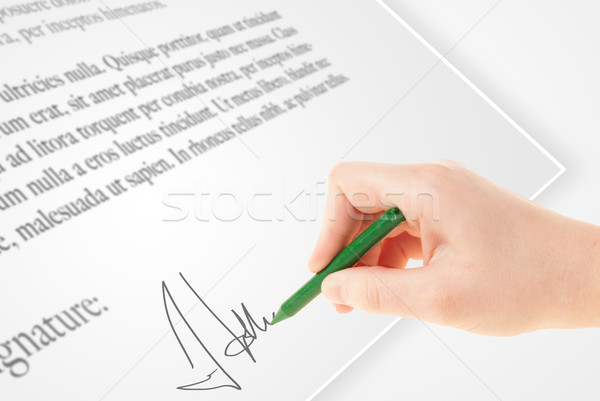 Hand writing personal signature on a paper form Stock photo © ra2studio