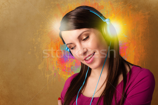 Young woman with headphones listening to music Stock photo © ra2studio