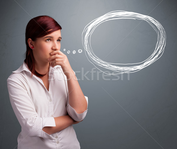 Young lady thinking about speech or thought bubble with copy spa Stock photo © ra2studio