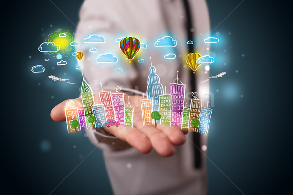Young businessman presenting colorful hand drawn metropolitan ci Stock photo © ra2studio