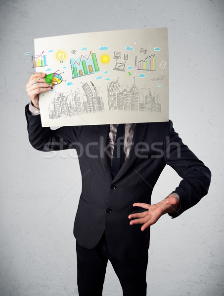 Businessman holding a paper with charts and cityscape in front o Stock photo © ra2studio