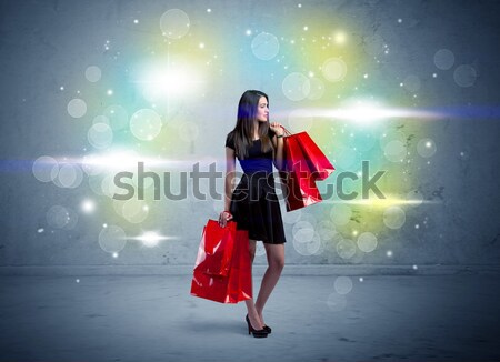 Mall lady with shopping bags and glitter light Stock photo © ra2studio