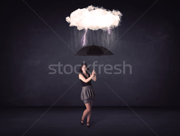 Businesswoman standing with umbrella and little storm cloud Stock photo © ra2studio