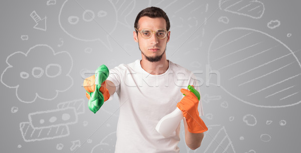 Male housekeeper with grey doodled wallpaper Stock photo © ra2studio
