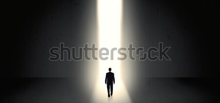 Stock photo: Businessman seeing the light at the end of something