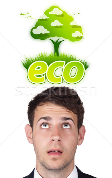 Stock photo: Young head looking at green eco sign