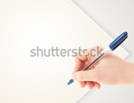 Hand writing on plain empty white paper copy space Stock photo © ra2studio
