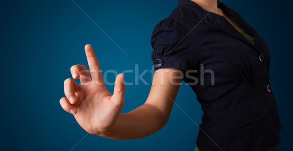 Kadın hayali düğme genç kadın el Stok fotoğraf © ra2studio