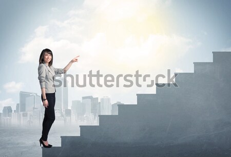 Kobieta interesu wspinaczki w górę konkretnych schody miasta Zdjęcia stock © ra2studio
