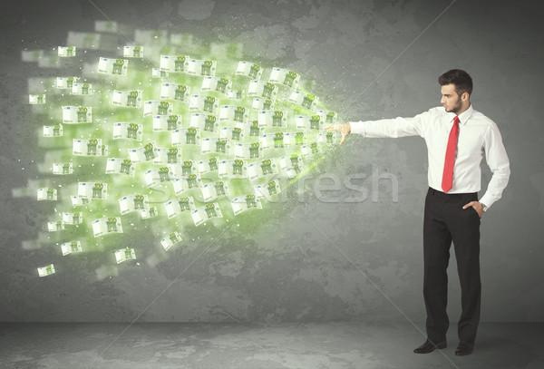 Young business person throwing money concept Stock photo © ra2studio